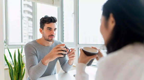 Confident man making eye contact during a conversation.